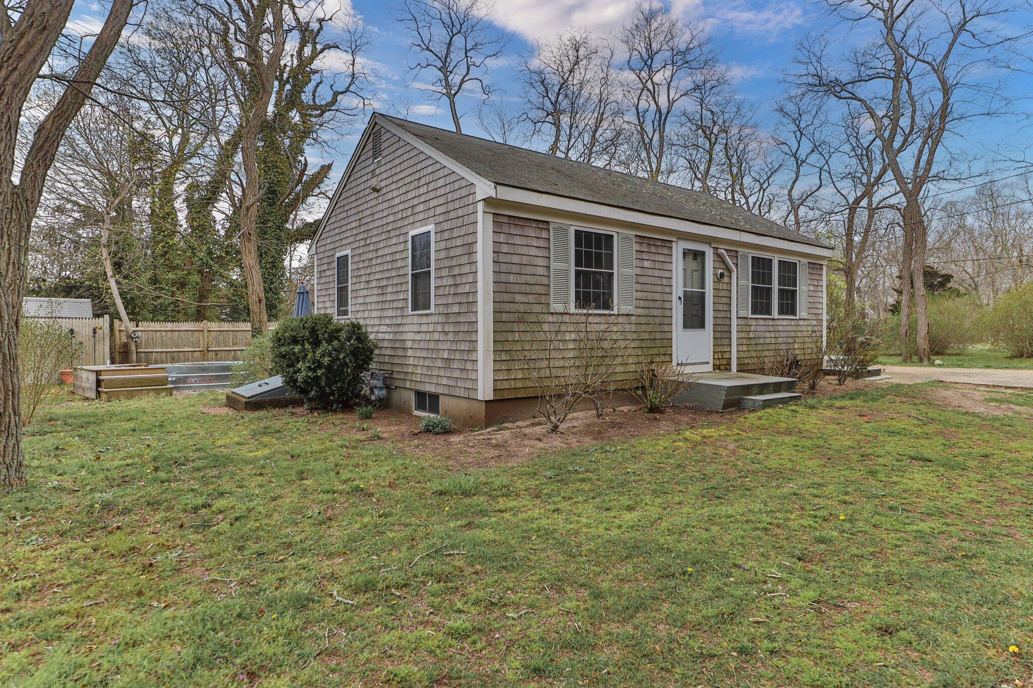 582 Massasoit Road Eastham, MA 02642 - Photo 39 of 45 a front view of a house with garden