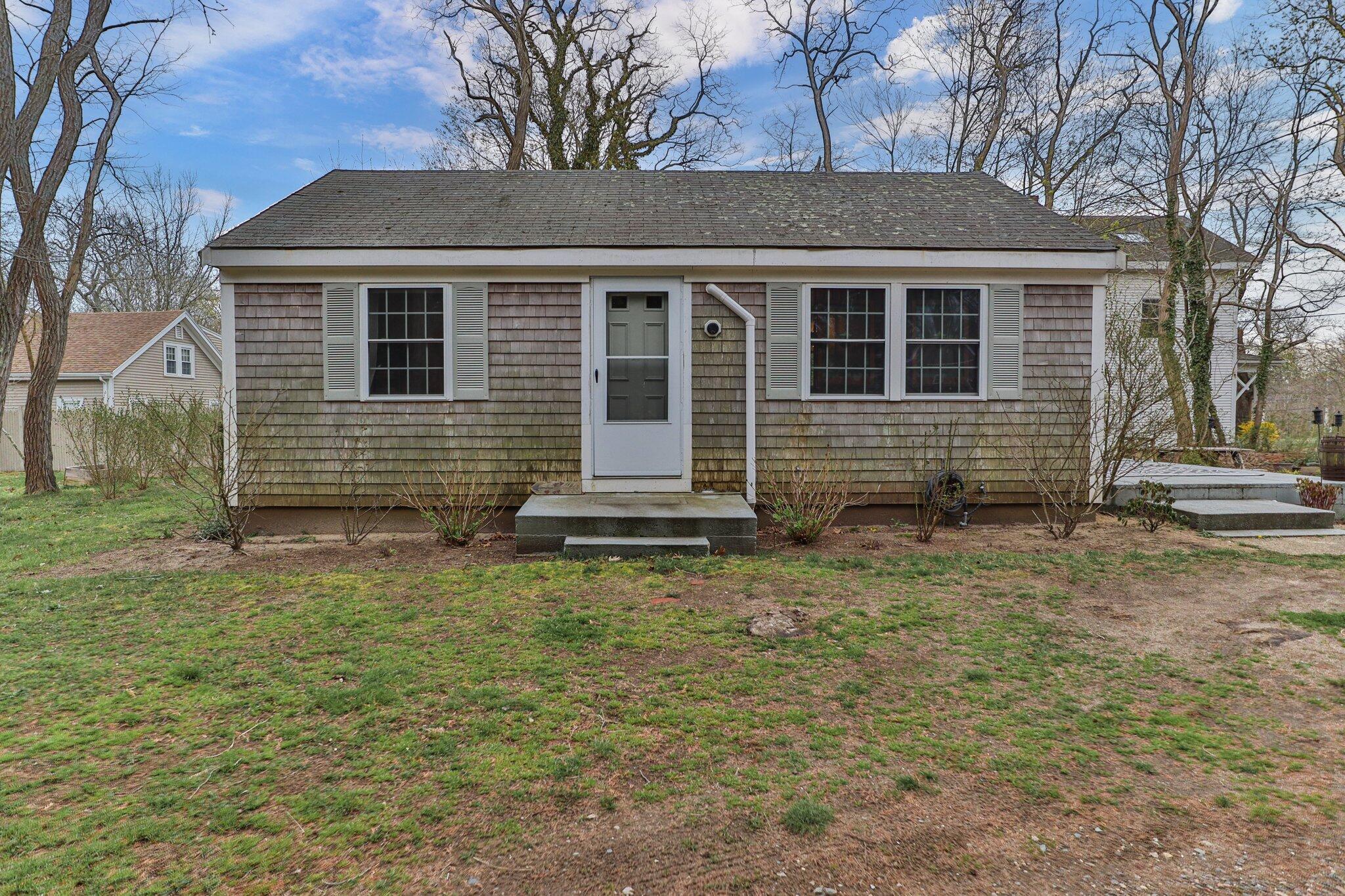 582 Massasoit Road Eastham, MA 02642 - Photo 40 of 45 a front view of a house with garden