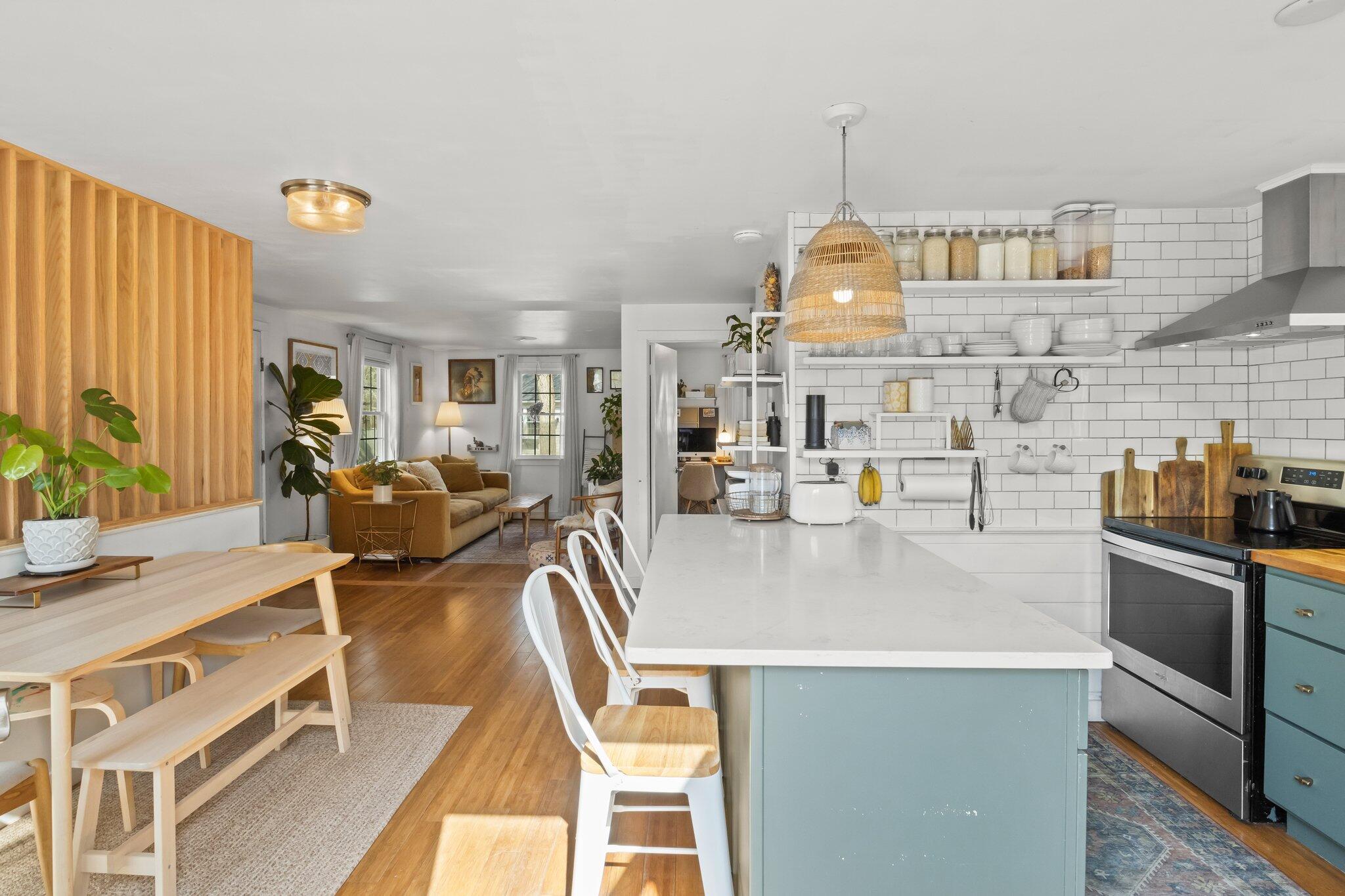 582 Massasoit Road Eastham, MA 02642 - Photo 4 of 45 a kitchen with a table chairs stove and cabinets