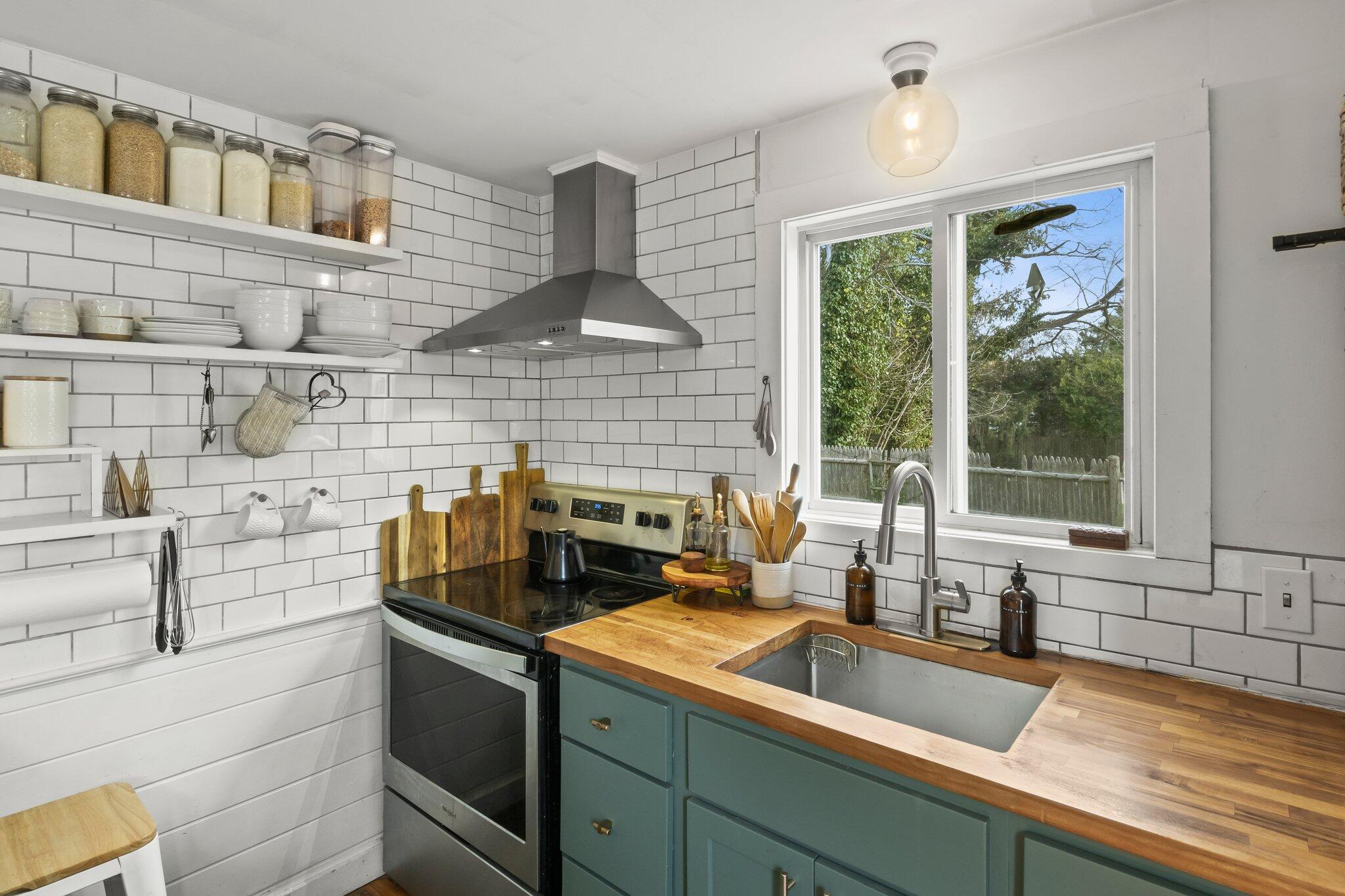 582 Massasoit Road Eastham, MA 02642 - Photo 10 of 45 a kitchen with a sink and a stove