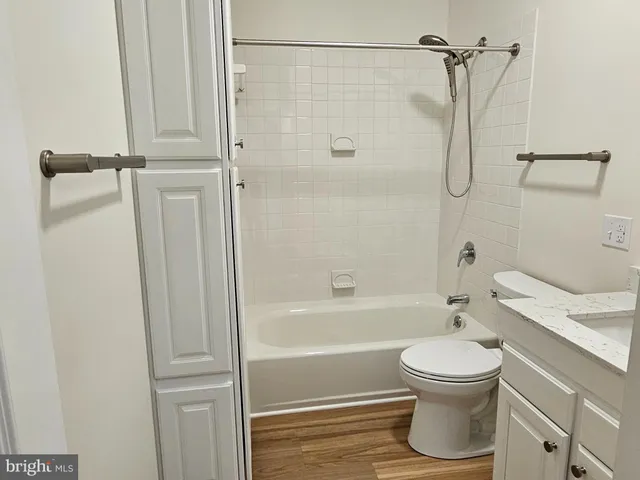 a bathroom with a shower a toilet and a sink