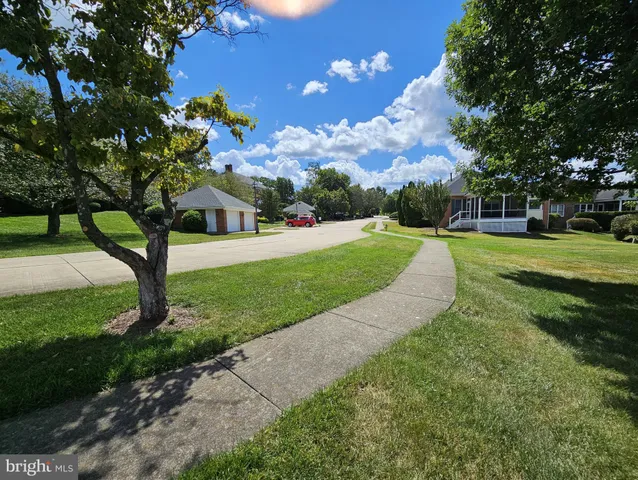 a view of a golf course with a big yard