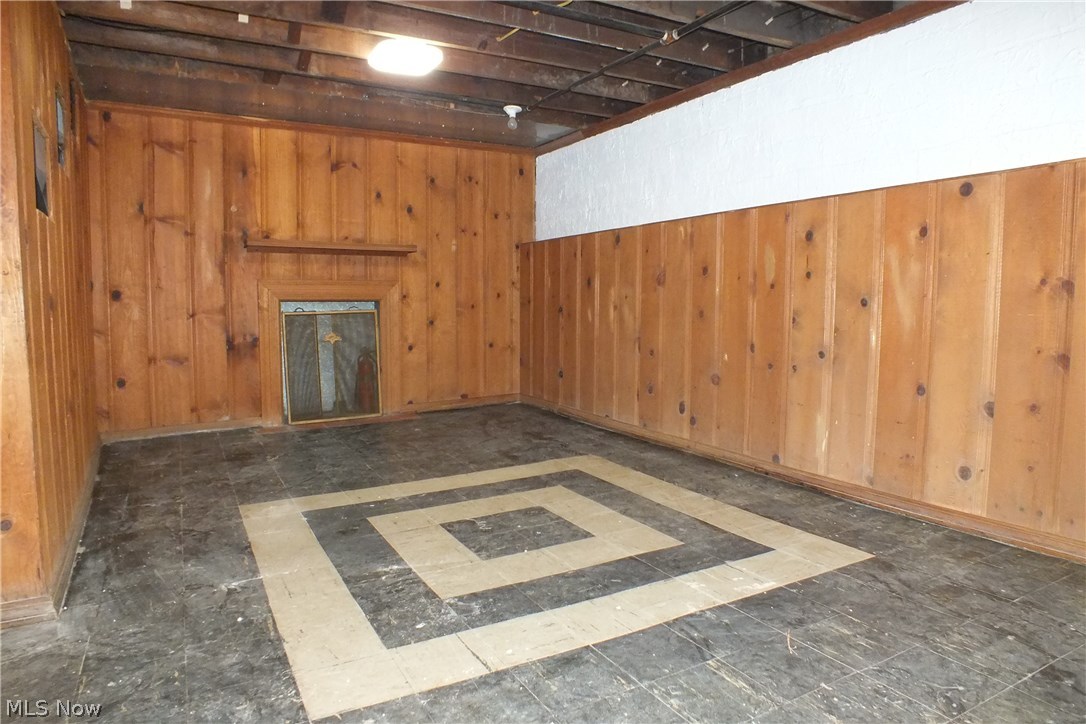 22651 Seabrooke Avenue Euclid, OH 44123 - Photo 24 of 31 The wood paneled lower level recreation room