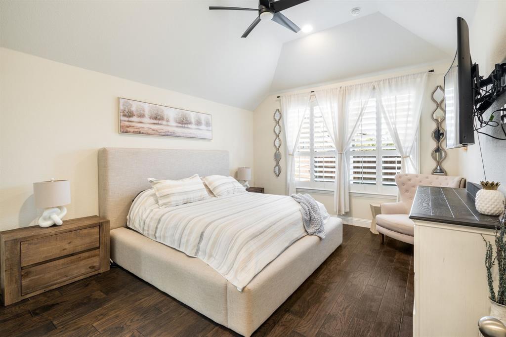1501 Snowdrop Drive Prosper, TX 75078 - Photo 16 of 27 a bedroom with a bed and a flat screen tv