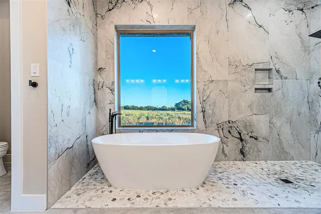 a view of a bathtub in a bathroom