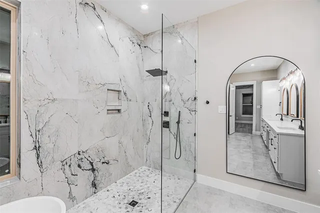 a bathroom with a sink and shower