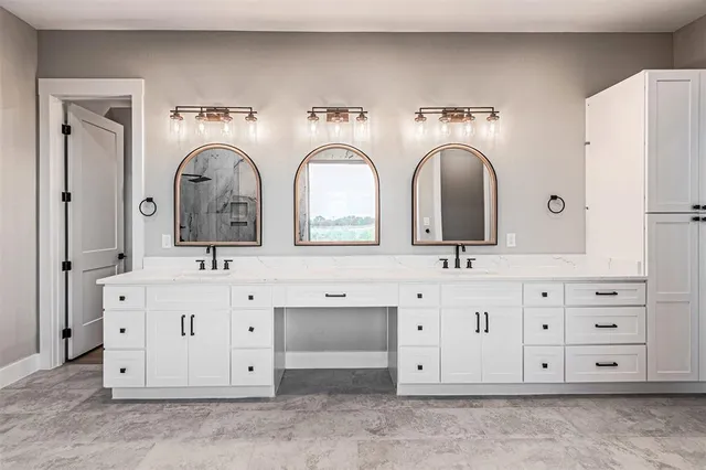 a bathroom with double vanity sinks a vanity and a