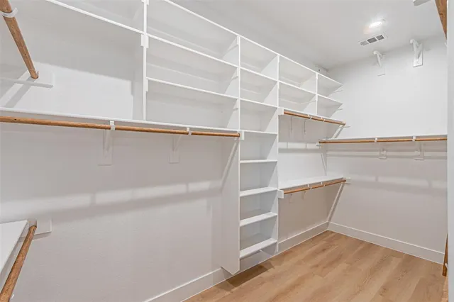 a view of an empty walk in closet