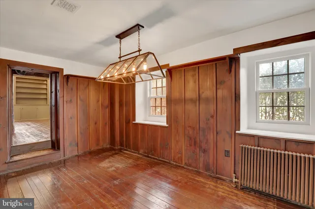 a kitchen with granite countertop a sink stove and cabinets