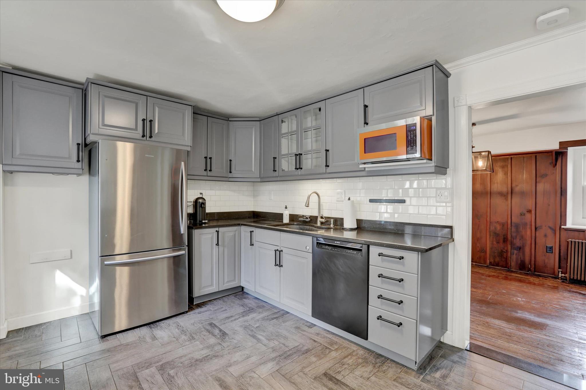 60 Quarry Road Doylestown, PA 18901 - Photo 19 of 70 a kitchen with stainless steel appliances granite countertop a refrigerator and a stove top oven