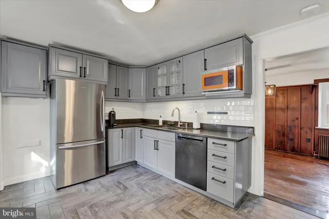 a living room with furniture a flat screen tv and a floor