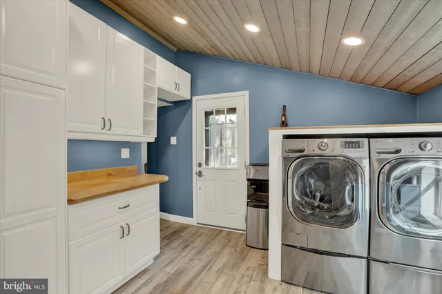 a view of an entryway with wooden floor