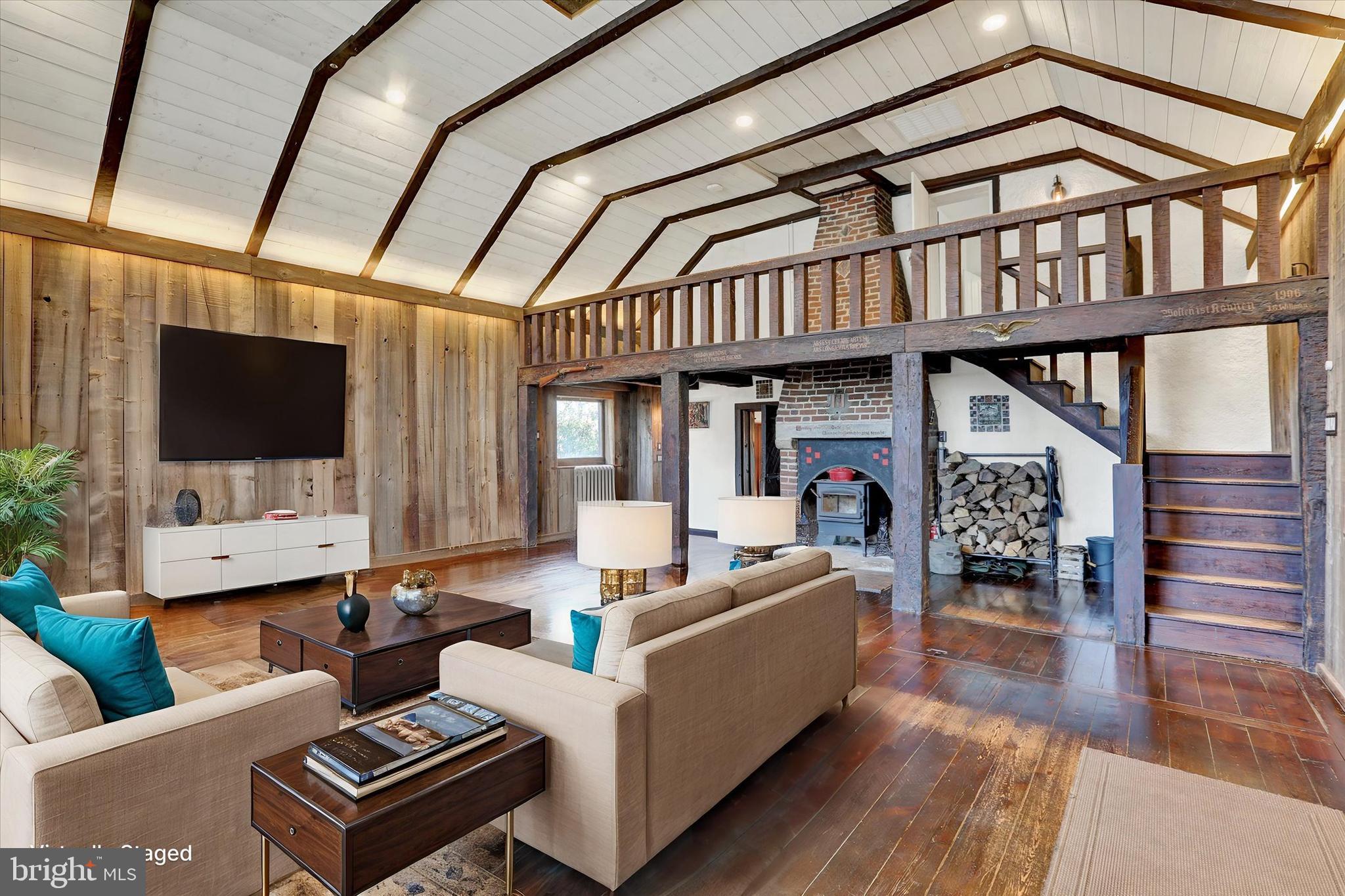 60 Quarry Road Doylestown, PA 18901 - Photo 24 of 70 a living room with furniture a flat screen tv and a floor