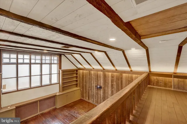 a bathroom with a sink vanity granite toilet and a mirror
