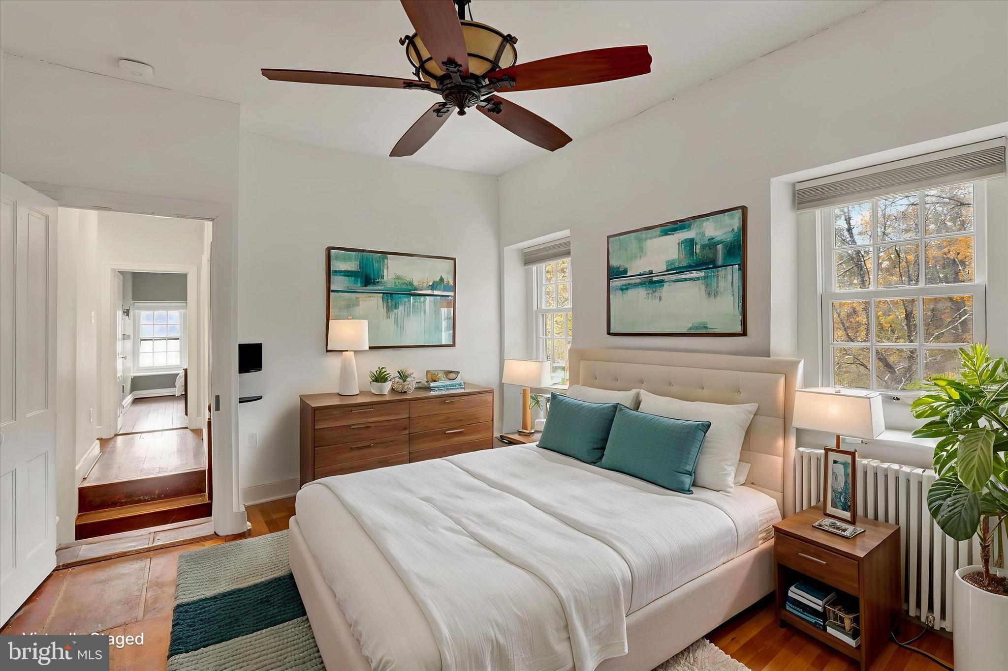 60 Quarry Road Doylestown, PA 18901 - Photo 37 of 70 a bedroom with a bed and a chandelier