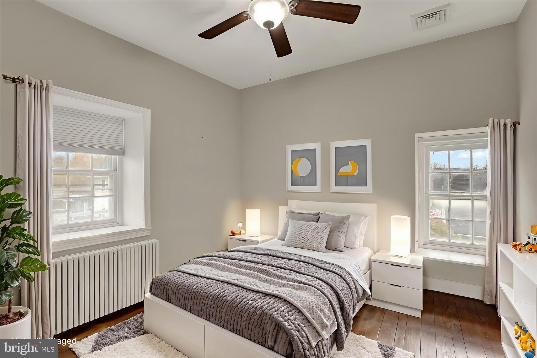 60 Quarry Road Doylestown, PA 18901 - Photo 42 of 70 a bedroom with a bed and wooden floor