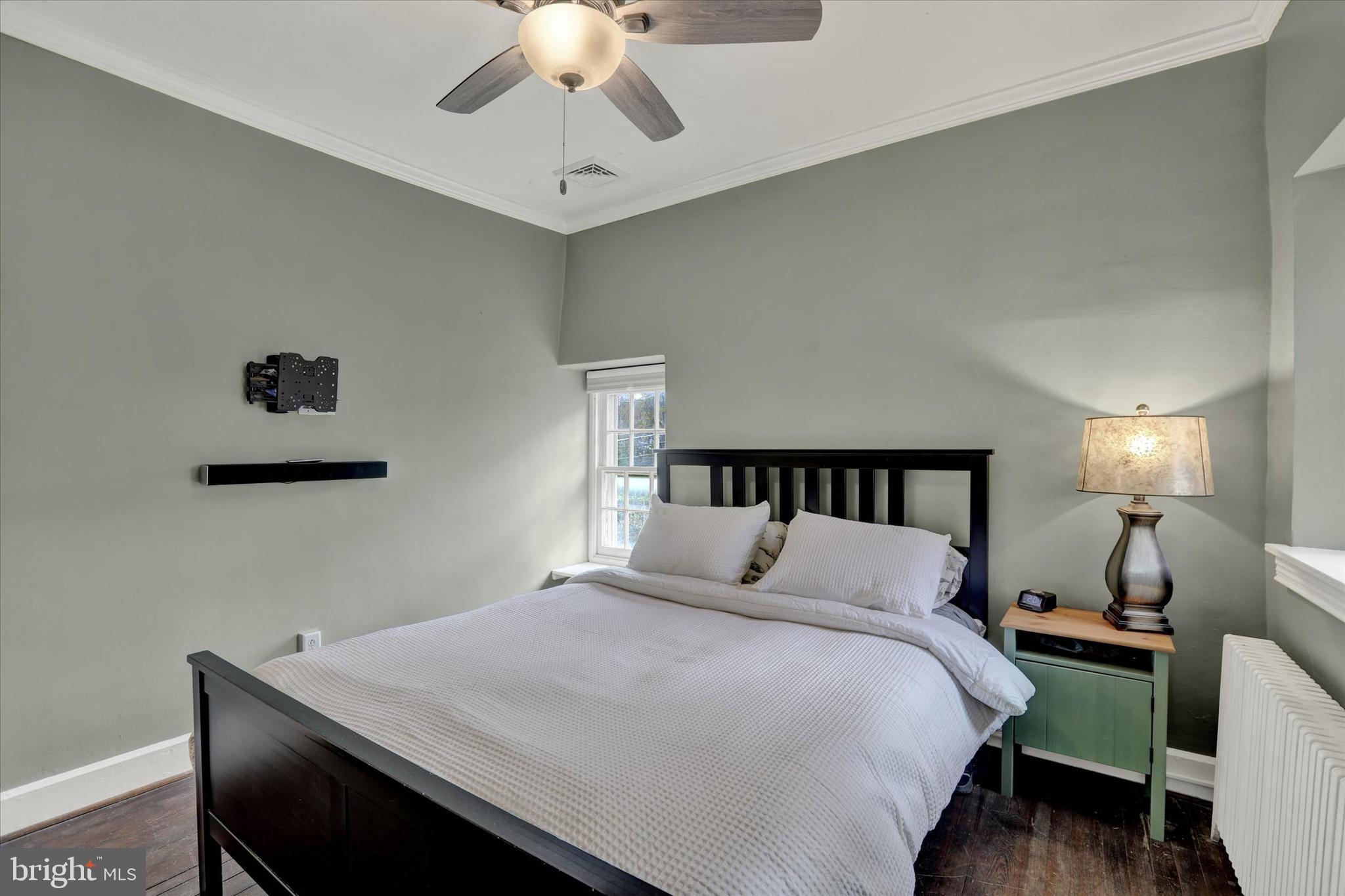 60 Quarry Road Doylestown, PA 18901 - Photo 48 of 70 a bedroom with a bed and a chandelier