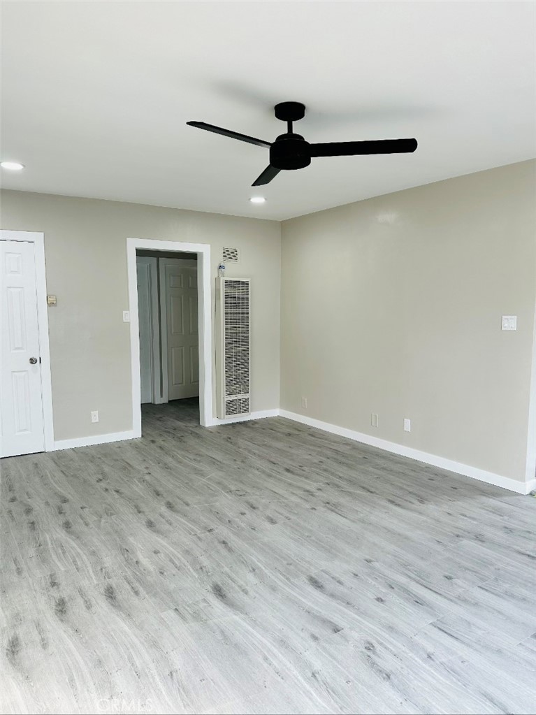 10026 Foster Road, Unit 1/2 Bellflower, CA 90706 - Photo 2 of 4 a view of empty room with wooden floor