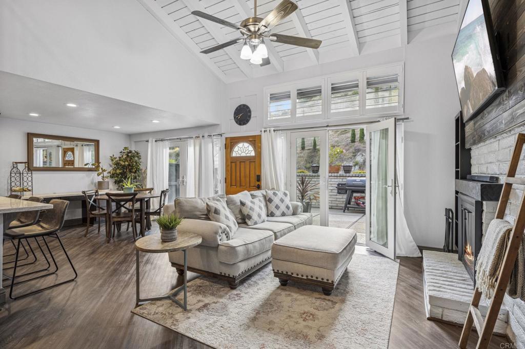 3404 Oak Cliff Drive, Unit 8 Fallbrook, CA 92028 - Photo 1 of 39 a living room with furniture dining area and a large window