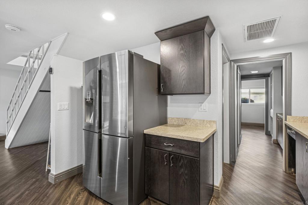 3404 Oak Cliff Drive, Unit 8 Fallbrook, CA 92028 - Photo 12 of 39 a kitchen with a refrigerator and a sink
