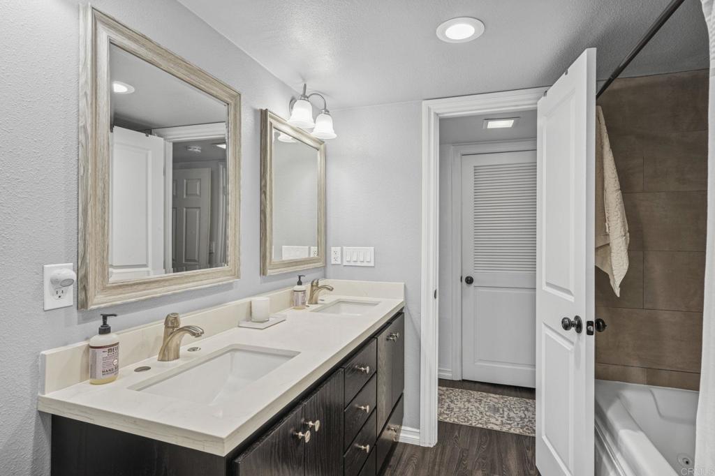 3404 Oak Cliff Drive, Unit 8 Fallbrook, CA 92028 - Photo 25 of 39 a bathroom with a sink double vanity and a mirror