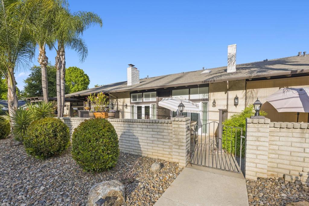 3404 Oak Cliff Drive, Unit 8 Fallbrook, CA 92028 - Photo 27 of 39 a front view of a house with garden