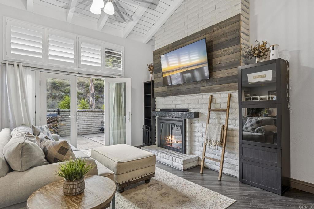 3404 Oak Cliff Drive, Unit 8 Fallbrook, CA 92028 - Photo 3 of 39 a living room with furniture and a flat screen tv