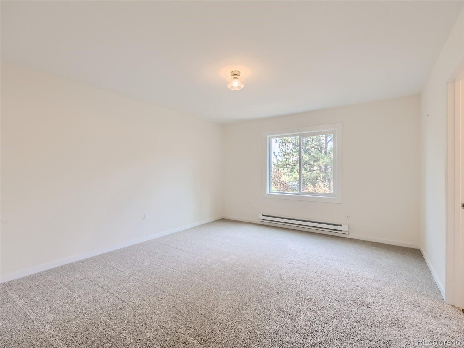 6124 Powell Road Parker, CO 80134 - Photo 20 of 50 an empty room with a window