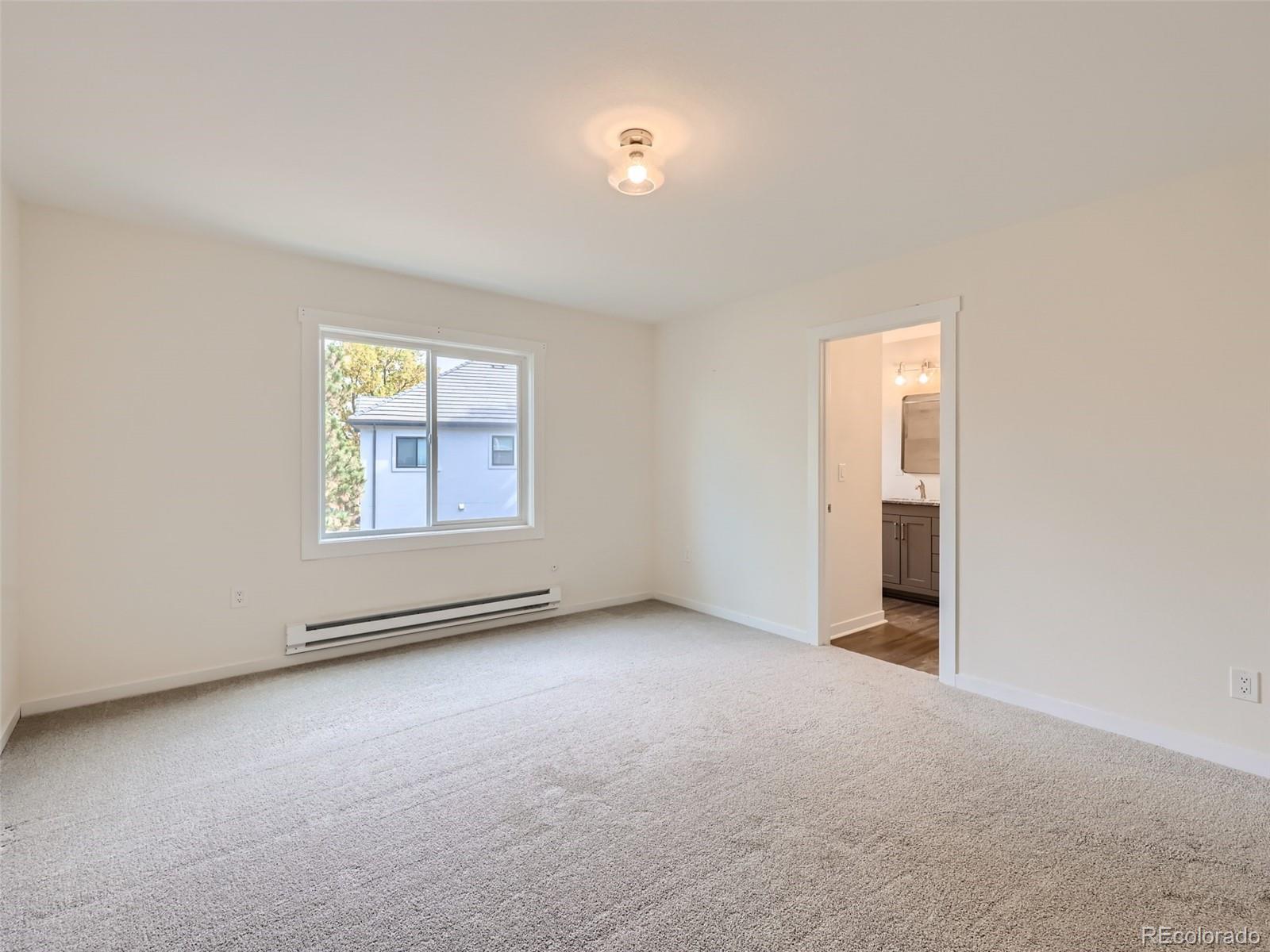 6124 Powell Road Parker, CO 80134 - Photo 21 of 50 an empty room with windows
