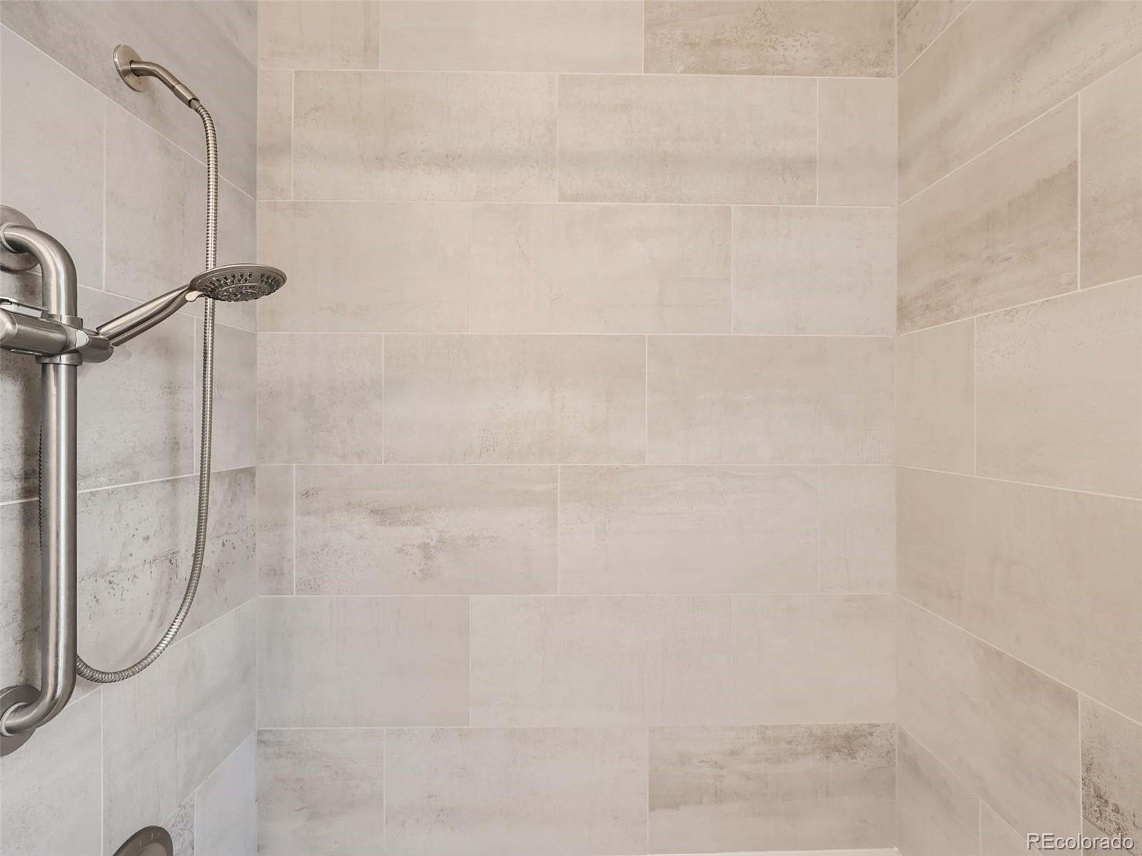 6124 Powell Road Parker, CO 80134 - Photo 23 of 50 a bathroom with a shower