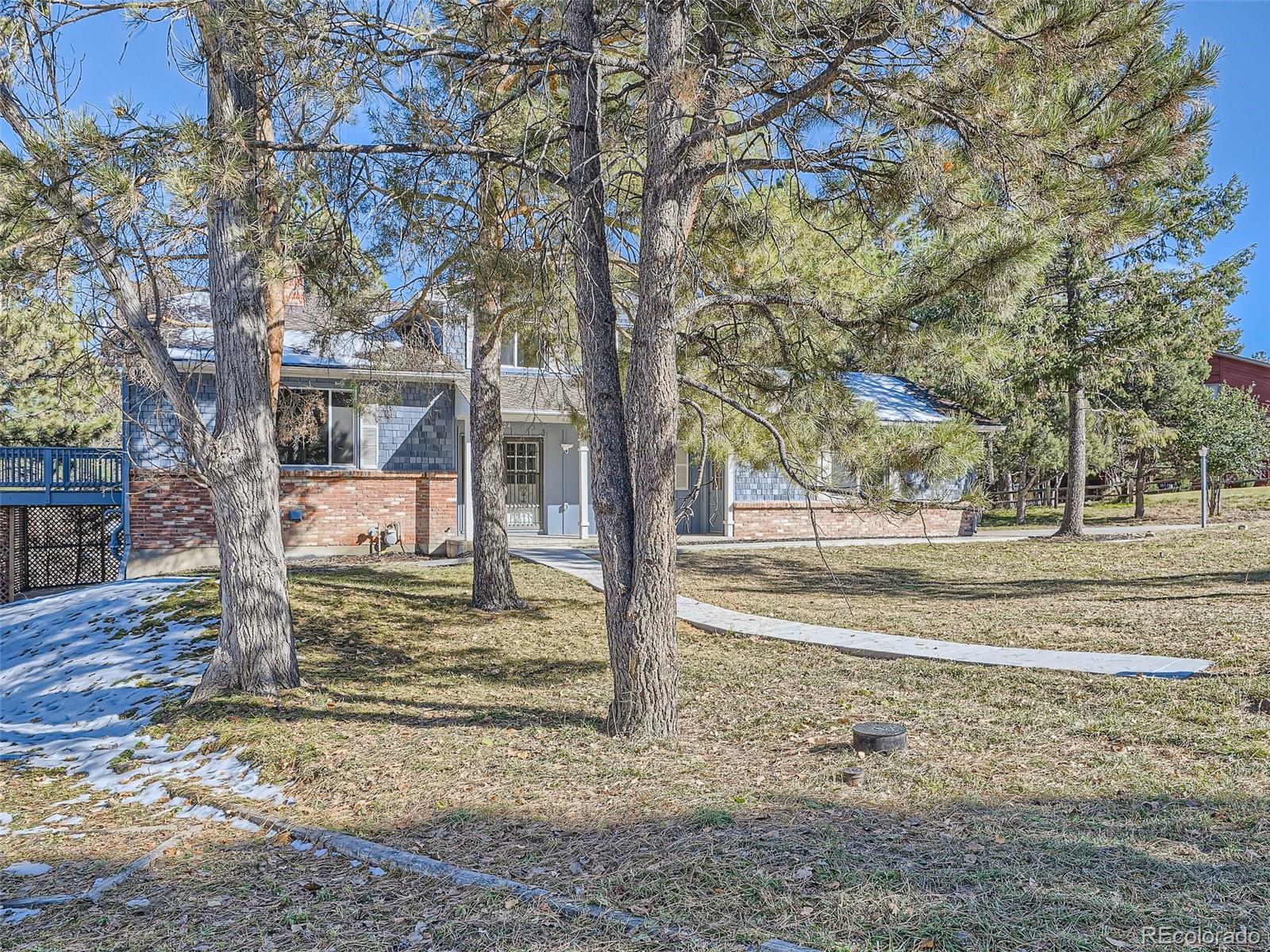 6124 Powell Road Parker, CO 80134 - Photo 3 of 50 a view of a yard with plants and trees