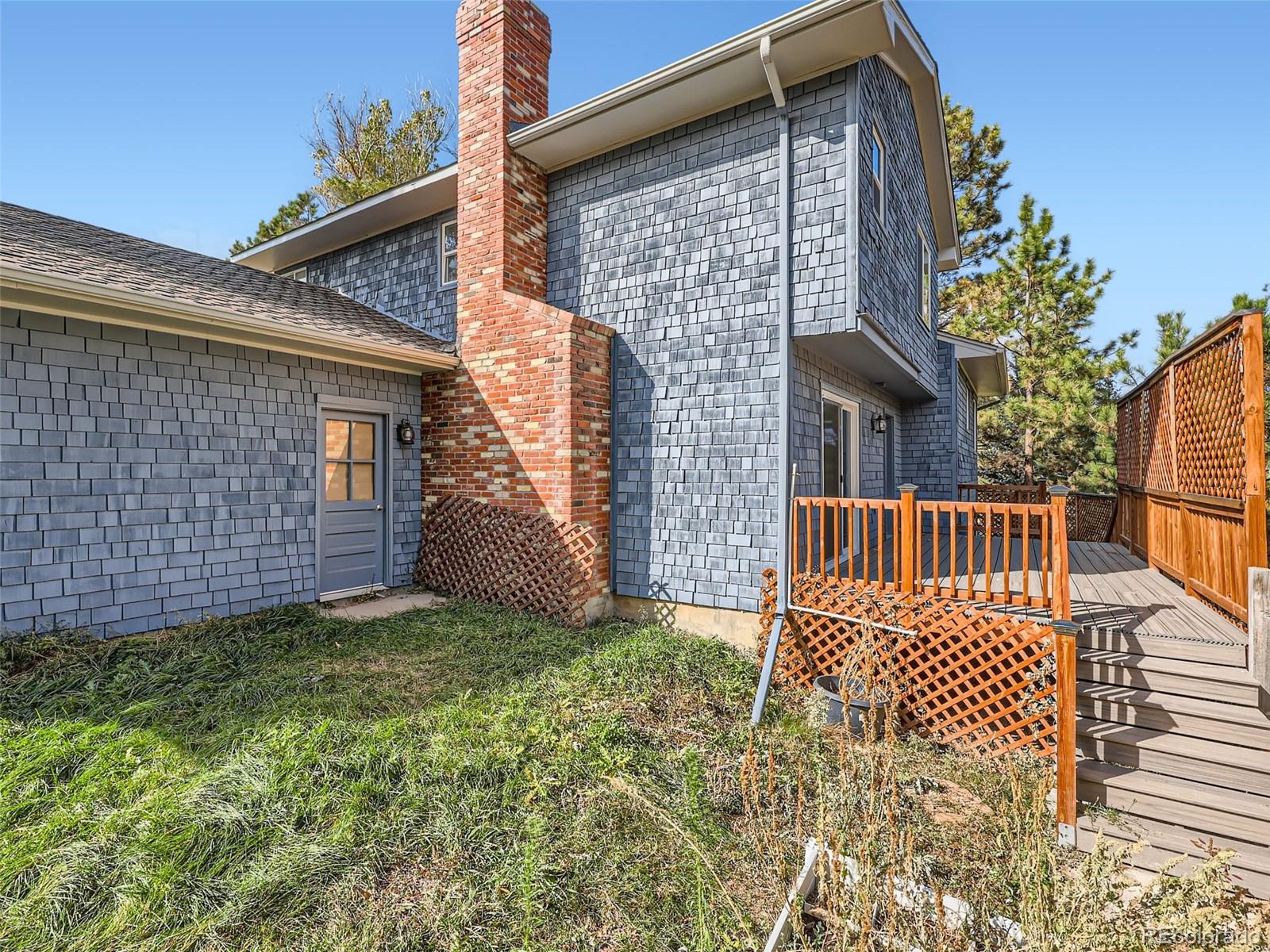 6124 Powell Road Parker, CO 80134 - Photo 39 of 50 a view of a house with a yard