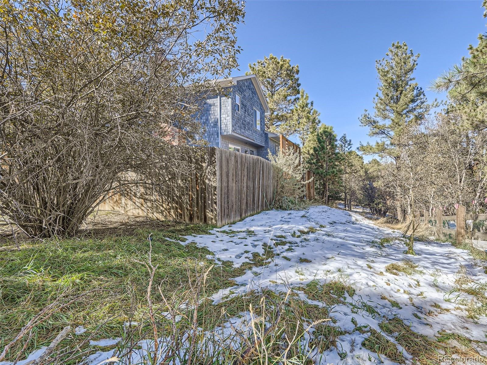 6124 Powell Road Parker, CO 80134 - Photo 41 of 50 a view of a house with a yard