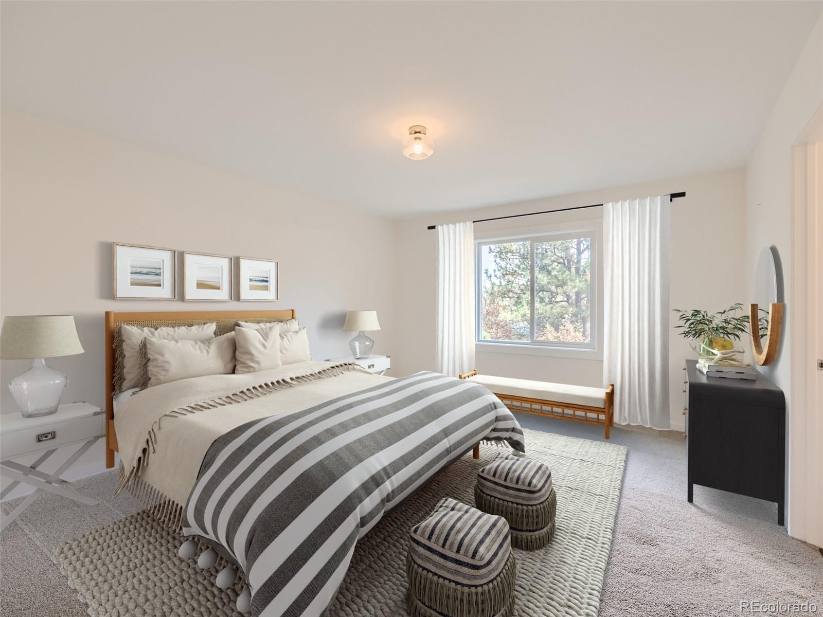 6124 Powell Road Parker, CO 80134 - Photo 50 of 50 a bedroom with a bed and a couch