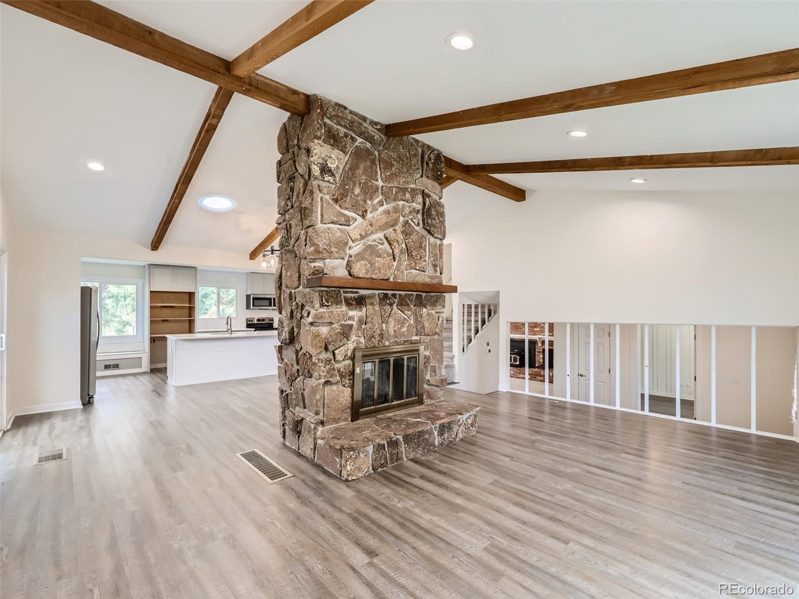 6124 Powell Road Parker, CO 80134 - Photo 7 of 50 a living room with furniture and a fireplace