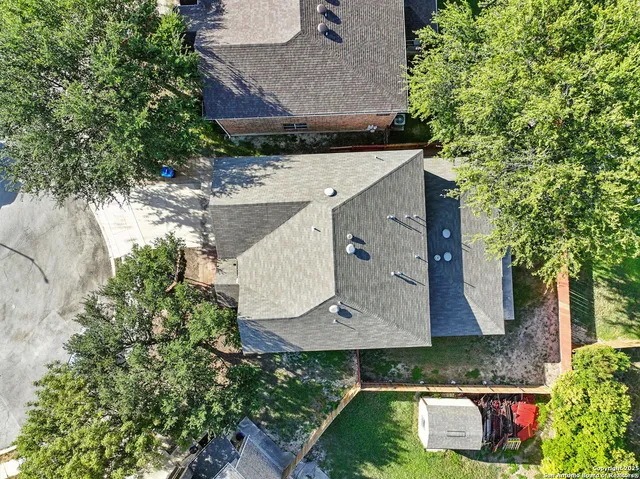 an aerial view of a house with swimming pool
