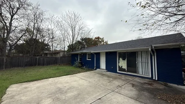 a view of a yard in front view of a house