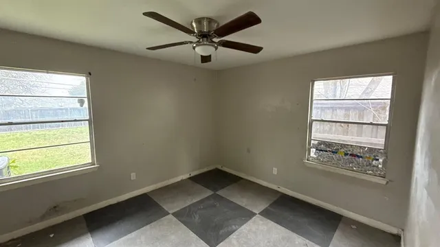 a view of an empty room with a window