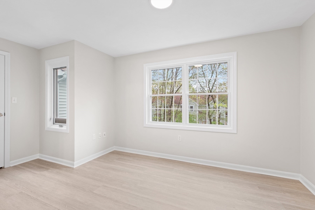 79 Patrick Road, Unit 79 Tewksbury, MA 01876 - Photo 12 of 18 an empty room with a window