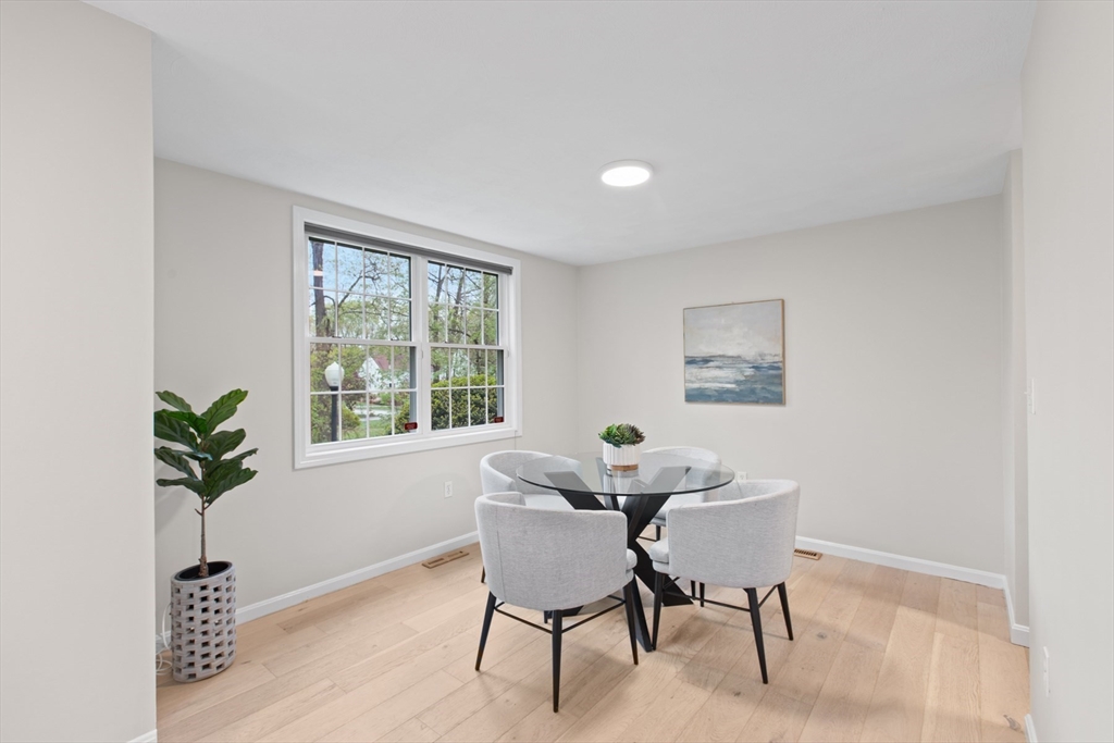 79 Patrick Road, Unit 79 Tewksbury, MA 01876 - Photo 9 of 18 a dining room with furniture and window