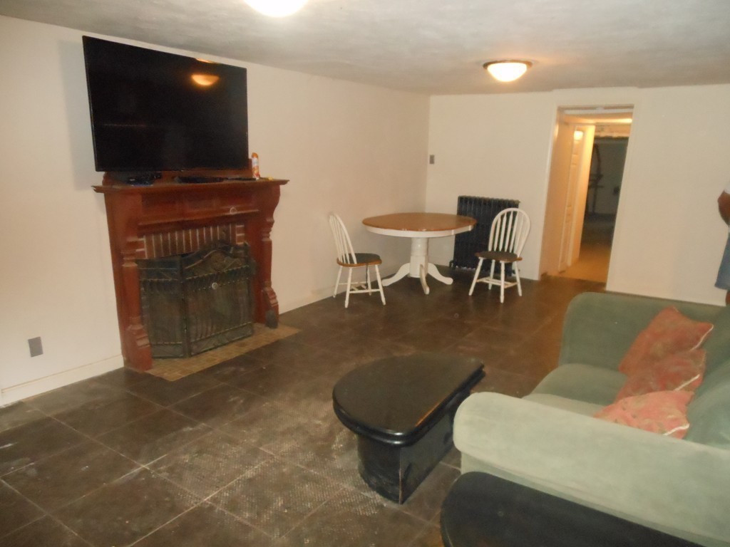 18 Pierce Street Malden, MA 02148 - Photo 17 of 29 a living room with furniture and a flat screen tv