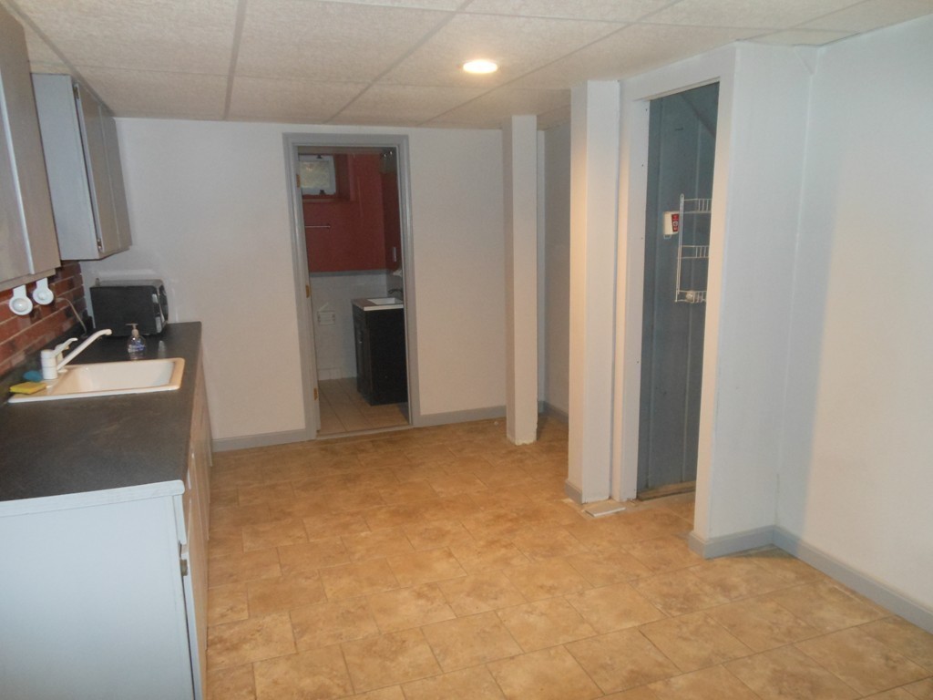 18 Pierce Street Malden, MA 02148 - Photo 18 of 29 a view of a room with a sink and cabinets
