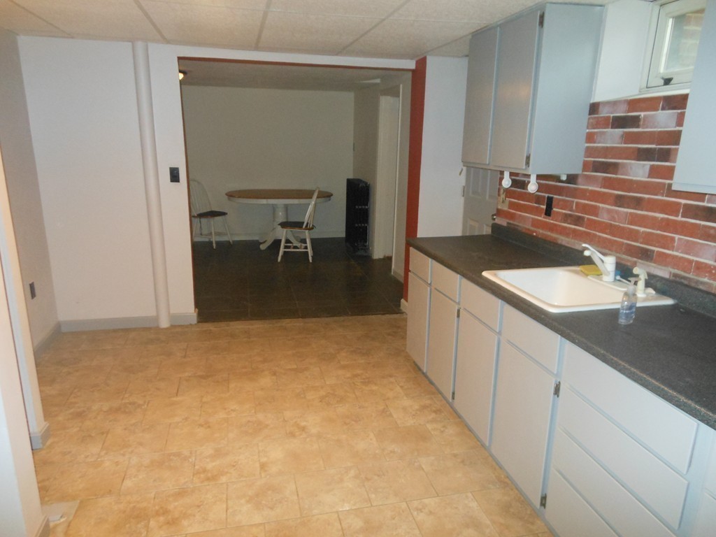 18 Pierce Street Malden, MA 02148 - Photo 19 of 29 a bathroom with a granite countertop sink and a mirror