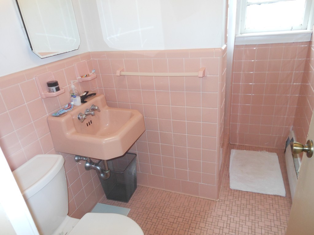 18 Pierce Street Malden, MA 02148 - Photo 24 of 29 a bathroom with a sink mirror and toilet