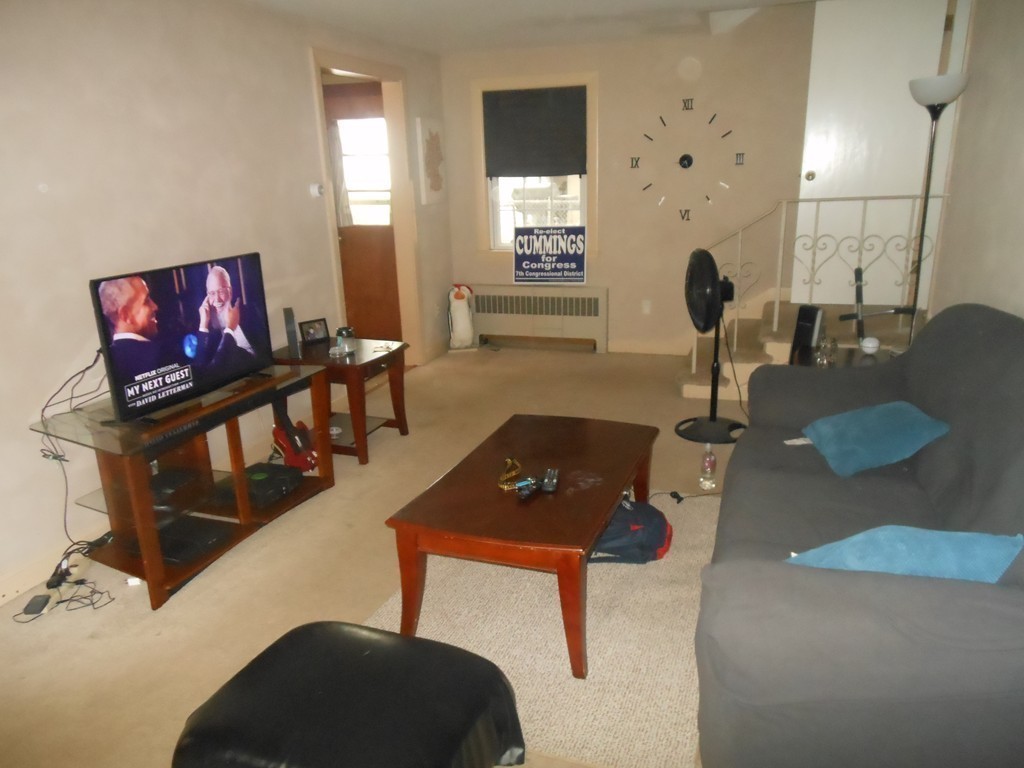 18 Pierce Street Malden, MA 02148 - Photo 26 of 29 a living room with furniture and a flat screen tv