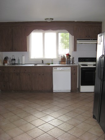 18 Pierce Street Malden, MA 02148 - Photo 3 of 29 a kitchen with granite countertop a stove a sink and a microwave