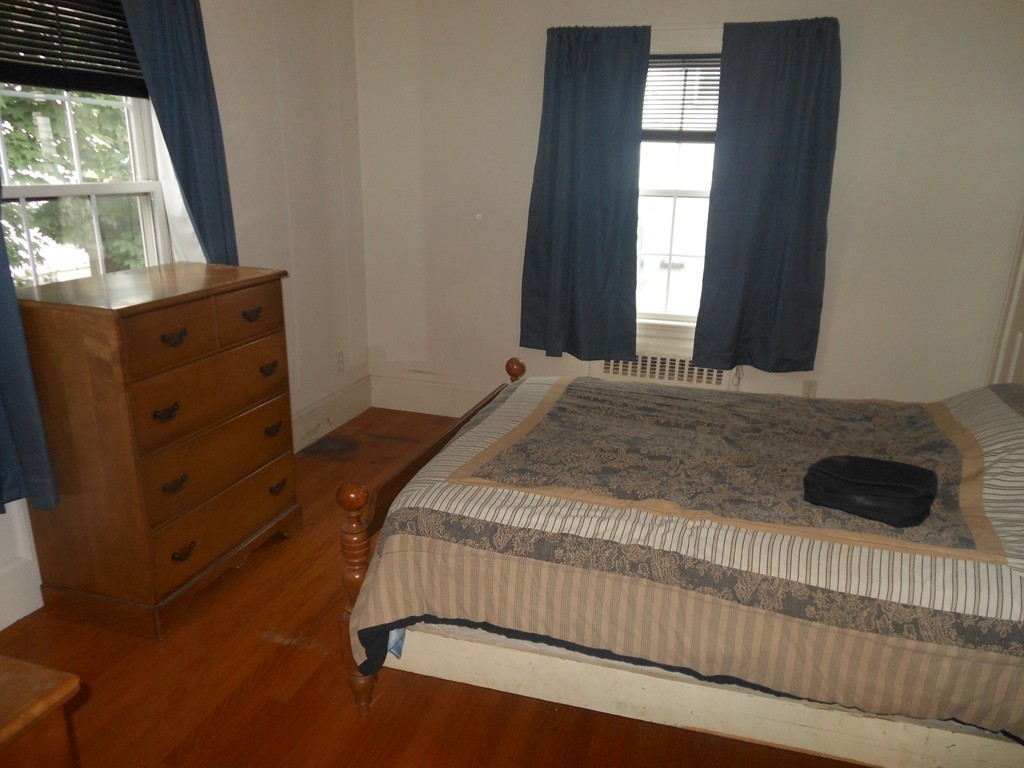 18 Pierce Street Malden, MA 02148 - Photo 10 of 29 a bedroom with a bed and a window