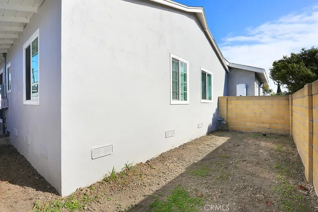 a view of a kitchen with wooden floor and electronic appliances