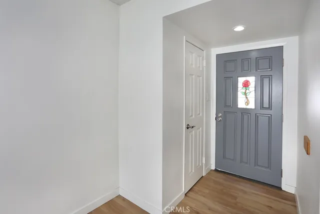 a kitchen with a stove and a white cabinets
