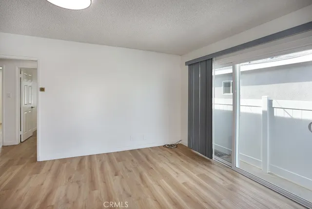 a kitchen with stainless steel appliances a white stove top oven and white cabinets